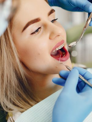 beautiful-girl-sitting-dentist-s-office-scaled.jpg